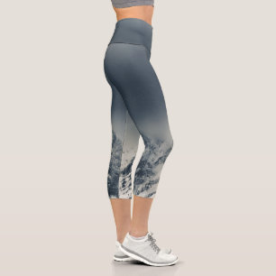 Darkness and clouds covering mountain capri leggings