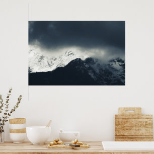 Darkness and light on snow covered mountains poster