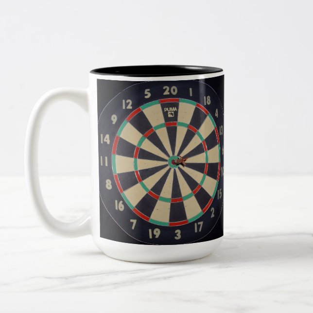 Dartboard With Dart In Bullseye, Two-Tone Coffee Mug (Left)