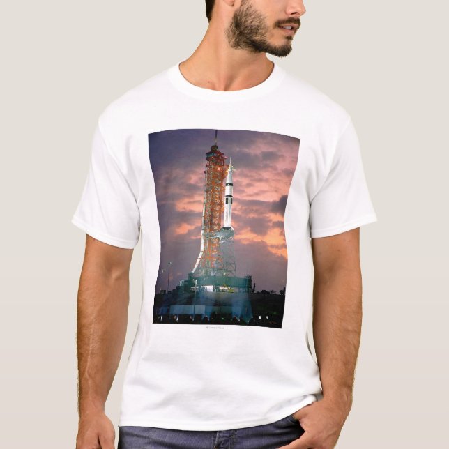 Dawn breaks behind ASTP Saturn IB CDDT T-Shirt (Front)