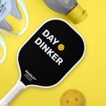 Day Dinker Custom Text Name Funny Pickleball Paddle<br><div class="desc">This funny pickleball paddle reads "DAY DINKER" in a bold white text that's set against a black background and highlighted by a yellow pickleball (you can easily change the background colour). Add 2 lines of custom text to personalise - club name, location, player's name, phone number, etc. Or delete. Makes...</div>