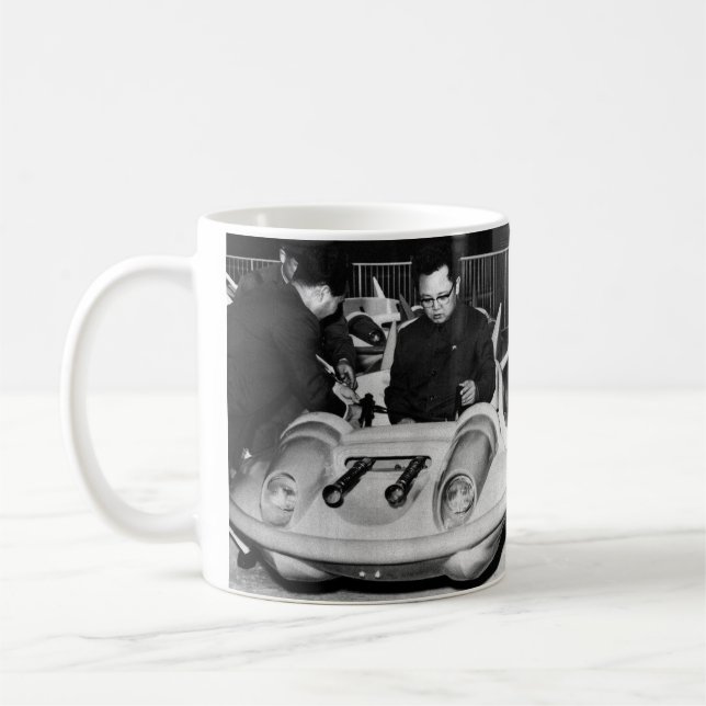Dear Leader Kim Jong il in a spaceship Coffee Mug (Left)