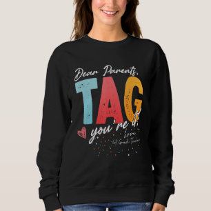 Dear Parents Tag You're It Love 1st Grade Teacher  Sweatshirt