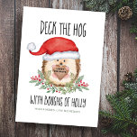 Deck the Hog Hedgehog Santa Holly Christmas Holiday Card<br><div class="desc">Share some holiday humor with this woodland animal theme Christmas card featuring a cute watercolor hedgehog in a Santa hat framed by holly boughs and berries, holding a rustic wood sign. Caption says "Deck The Hog With Boughs Of Holly". Greeting inside the wood sign (shown with Happy Holidays") can be...</div>