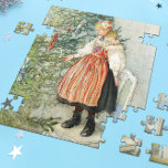 Decorating the Christmas Tree - Carl Larsson Jigsaw Puzzle<br><div class="desc">Swedish art by artist Carl Larsson. A blonde girl in traditional dress stands on a chair to decorate the Christmas tree. See store for coordinating items! About the artist: Carl Larsson was Swedish painter, illustrator, printmaker, and writer. He is now remembered mainly his watercolors of the idyllic life he enjoyed...</div>