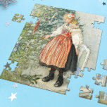Decorating the Christmas Tree - Carl Larsson Jigsaw Puzzle<br><div class="desc">Swedish art by artist Carl Larsson. A blonde girl in traditional dress stands on a chair to decorate the Christmas tree. See store for coordinating items! About the artist: Carl Larsson was Swedish painter, illustrator, printmaker, and writer. He is now remembered mainly his watercolors of the idyllic life he enjoyed...</div>