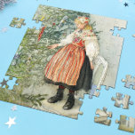 Decorating the Christmas Tree - Carl Larsson Jigsaw Puzzle<br><div class="desc">Swedish art by artist Carl Larsson. A blonde girl in traditional dress stands on a chair to decorate the Christmas tree. See store for coordinating items! About the artist: Carl Larsson was Swedish painter, illustrator, printmaker, and writer. He is now remembered mainly his watercolors of the idyllic life he enjoyed...</div>