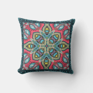 Decorative colourful ornament on a black backgroun cushion