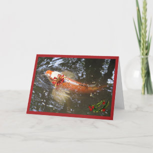 Decorative koi with bow and holly for the holidays holiday card