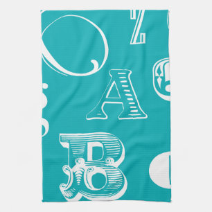 Decorative Letters on Blue Background Tea Towel