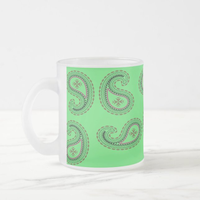 Decorative paisley pattern on green frosted glass coffee mug (Left)