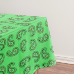 Decorative paisley pattern on green tablecloth