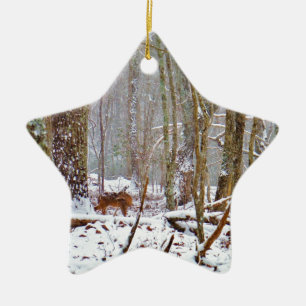 Deer in the snow, licking leg ceramic tree decoration