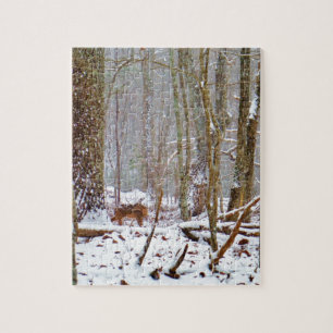 Deer in the snow, licking leg jigsaw puzzle