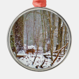 Deer in the snow, licking leg metal tree decoration