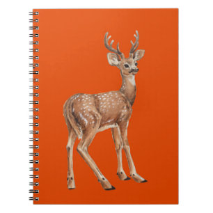 Deer on red notebook