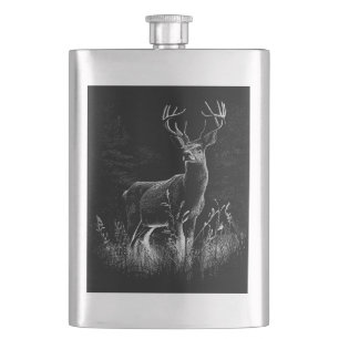 Deer with antlers framed by field and tree     hip flask