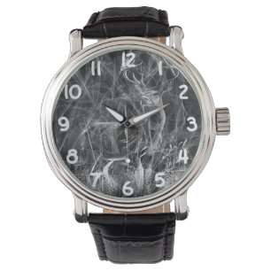 Deer with antlers framed by field and tree      watch