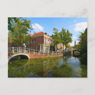Delft, canal, bridge, and old houses postcard