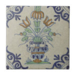 Delft Tile Antique Ceramic Flower Pot<br><div class="desc">Adorn your space with the charming simplicity of this vintage Pompadour tile, featuring a delightful multicolored flower pot. This original public domain image from the Rijksmuseum showcases the characteristic artistry of historical Dutch Delftware. The central flower pot, brimming with blue, green, and orange blooms, is framed by elegant blue scrolled...</div>
