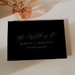 Delicate Gold and Black Monogram Back Wedding Guest Book<br><div class="desc">This delicate gold and black monogram back wedding guest book is perfect for a modern wedding. The romantic minimalist design features lovely and elegant champagne golden yellow typography on a black background with a clean and simple look. Personalise the front cover with the names of the bride and groom and...</div>