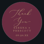 Delicate Gold Burgundy Thank You Favour Sticker<br><div class="desc">These delicate gold burgundy thank you wedding favour stickers are perfect for a modern wedding reception. The romantic minimalist design features lovely and elegant champagne golden yellow typography on a burgundy red background with a clean and simple look. Personalise the sticker labels with your names, the event (if applicable), and...</div>