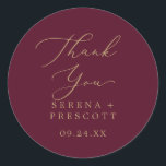 Delicate Gold Burgundy Thank You Favour Sticker<br><div class="desc">These delicate gold burgundy thank you wedding favour stickers are perfect for a modern wedding reception. The romantic minimalist design features lovely and elegant champagne golden yellow typography on a burgundy red background with a clean and simple look. Personalise the sticker labels with your names, the event (if applicable), and...</div>