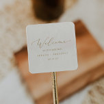 Delicate Gold Calligraphy | Cream Wedding Welcome Square Sticker<br><div class="desc">These delicate gold calligraphy cream wedding welcome stickers are perfect for a modern wedding. The romantic minimalist design features lovely and elegant champagne golden yellow typography on an ivory cream background with a clean and simple look. Personalise these stickers with the location of your wedding, names, and wedding date. These...</div>