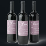 Delicate orchid cheers to wedding purple custom wine label<br><div class="desc">Elegant customisable wine labels for your wedding reception, featuring beautiful and delicate white orchids line drawing on one side, over a romantic dusty purple background, and the wording "Cheers to the wedding of" in white fonts. Easily edit the template fields to add the bride and groom names in a classy...</div>