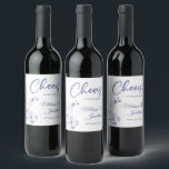 Delicate orchid cheers to wedding purple custom wine label<br><div class="desc">Elegant customisable wine labels for your wedding reception, featuring beautiful and delicate periwinkle purple orchids line drawing on one side, over a classic white background, and the wording "Cheers to the wedding of" in purple fonts. Easily edit the template fields to add the bride and groom names in a classy...</div>