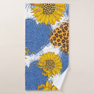 Denim hearts made of fabric with torn edges and le bath towel