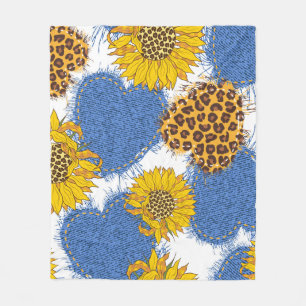 Denim hearts made of fabric with torn edges and le fleece blanket