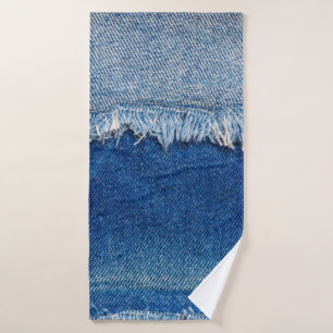 Denim jeans background. Ripped denim fabric with b Bath Towel