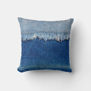 Denim jeans background. Ripped denim fabric with b Cushion