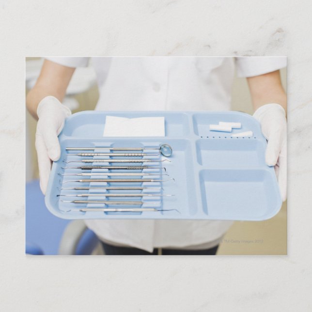 Dental hygienist  holding tray of dental postcard (Front)
