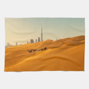 Deserts   Dubai's Skyline View with Camels Tea Towel