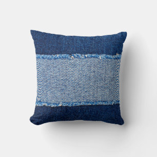 Destroyed torn denim blue jeans fabric frame on bl cushion