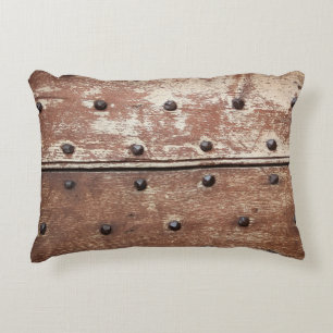 Detail of an old painted shabby door with rusty me decorative cushion