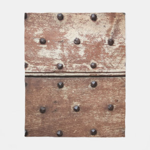 Detail of an old painted shabby door with rusty me fleece blanket