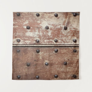 Detail of an old painted shabby door with rusty me tapestry
