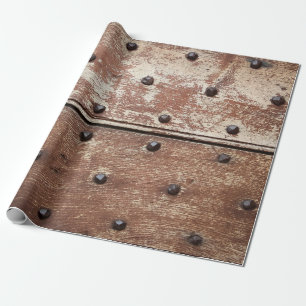 Detail of an old painted shabby door with rusty me wrapping paper