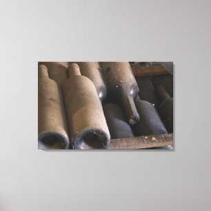 Detail of dusty bottles sur lattes on wooden canvas print