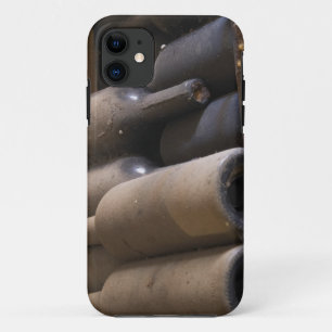 Detail of dusty bottles sur lattes on wooden iPhone 11 case