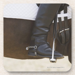 detail of female dressage rider on horse coaster