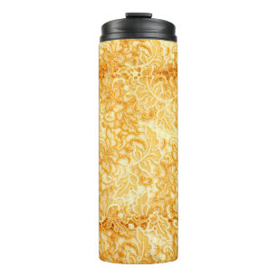 Detail of gold lace pattern fabric of cloth thermal tumbler
