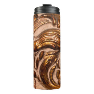 detail of ornamental picture frame, bronze colour. thermal tumbler