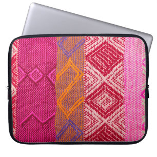 Details shot of indian fabric with colourful patte laptop sleeve