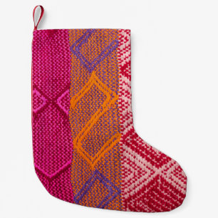 Details shot of indian fabric with colourful patte small christmas stocking