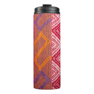 Details shot of indian fabric with colourful patte thermal tumbler