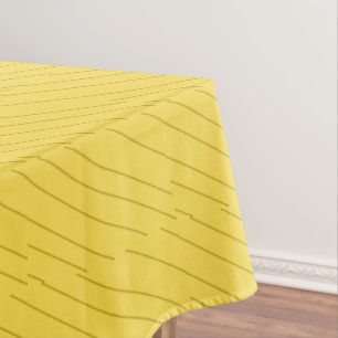 Diagonal brown stripes on mustard yellow tablecloth